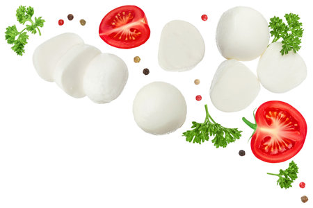Mini mozzarella balls with parsley and tomato isolated on white background. Top view. Flat lay.の写真素材