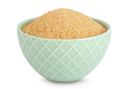 The brown sugar in ceramic bowl isolated on white backgroundの写真素材