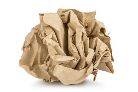 Crumpled brown sheet of paper isolated on white backgroundの写真素材