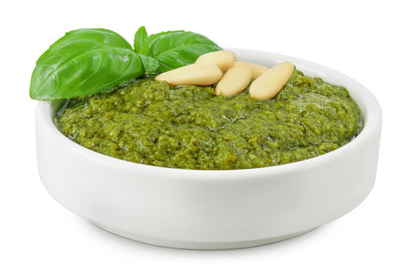 Pesto sauce in ceramic bowl isolated on white backgroundの写真素材