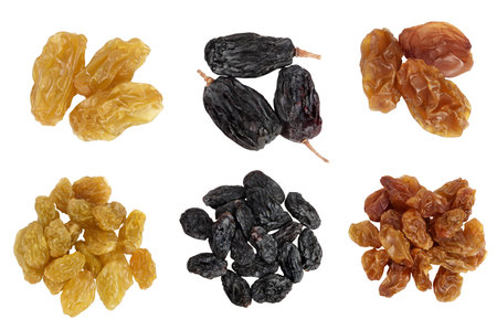 Black, yellow and brown raisins isolated on white background . Top view. Flat lay. Set or collectionの写真素材