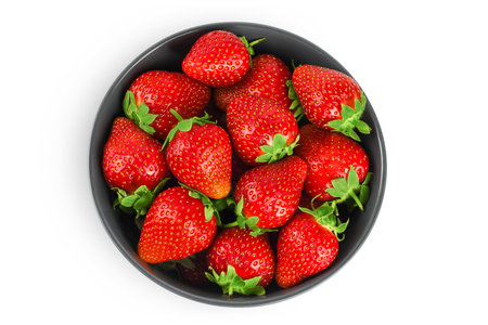 Strawberry in a ceramic bowl isolated on white background, Top view. Flat lay.の写真素材