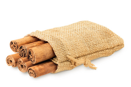 Cinnamon sticks in a bag isolated on white background with full depth of fieldの写真素材