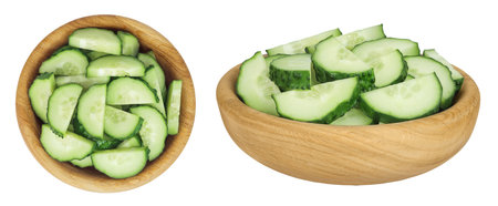 Sliced cucumber in wooden bowl isolated on white background with full depth of field. Top view. Flat lay.の写真素材
