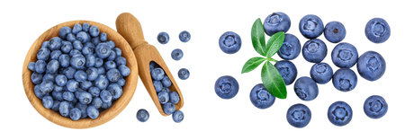 blueberry in wooden bowl isolated on white background. Top view. Flat lay.
