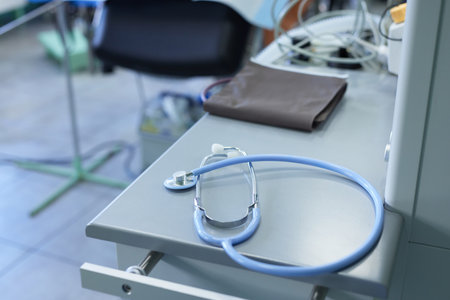 stethoscope on the table against the background of the hospital room, selective focusの写真素材