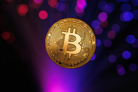 Glowing Bitcoin cryptocurrency against the background of fiber optic cables. Bitcoin digital cryptocurrency consisting of dots and lines, cryptocurrency mining. cryptocurrency exchangeの写真素材