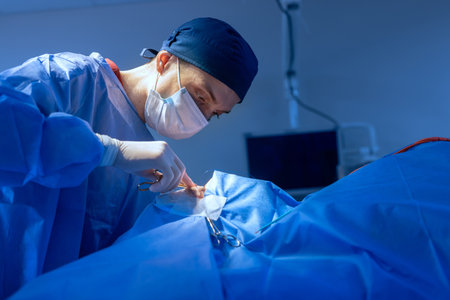 Blepharoplasty, plastic surgery to correct defects of the eyelids and eyes to aesthetically modify the eye area. removal of fat deposits, in a medical clinic, a surgical team performs an operationの写真素材