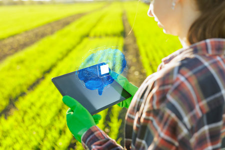farmer successfully uses artificial intelligence on argo farm, agronomist with tablet on background...