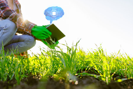 farmer successfully uses artificial intelligence on argo farm, agronomist with tablet on background...