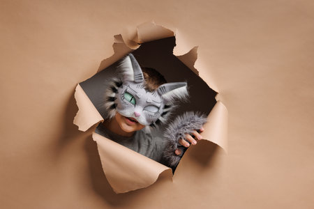 quadrobics portrait, Teenager in cat mask on beige background, studio photo, subcultureの写真素材