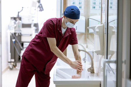 male surgeon washes his hands before surgery, doctor's sterile handsの写真素材