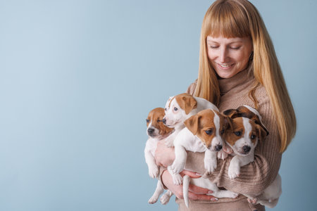 Woman holding puppies shows love for animals, pet care, nurturing, affection and joyful...