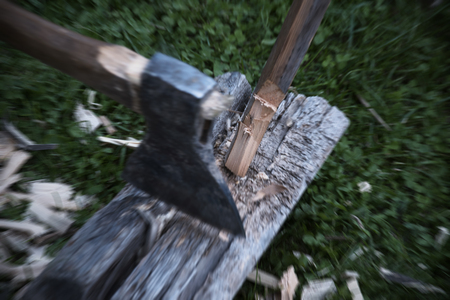 Ax and wood chips fly. Horizontal unfocused backgroundの写真素材