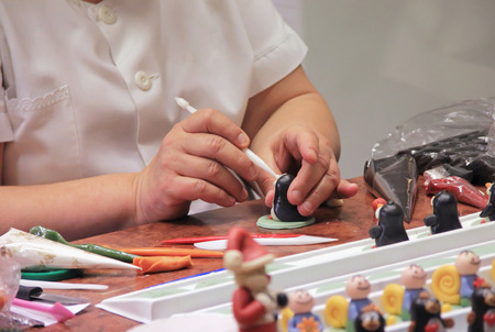 hand molded figures of marzipan modeling, preparation of sweet decorations for cakes and pies,...
