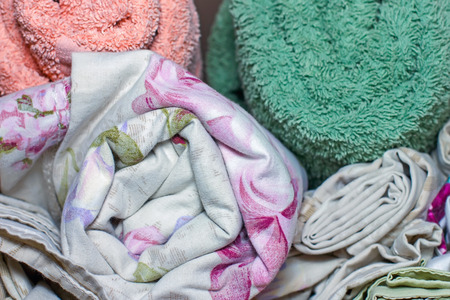 linens rolling rolls piled stacks in a closet, cabinet furniture for home and interior home textiles...