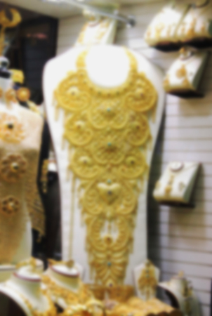 the gold market, gold jewelry and clothing, blurredの写真素材