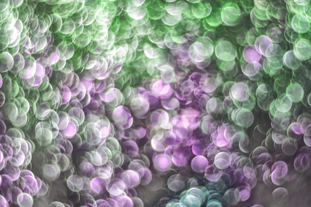 texture of bright blurry background of sparkles, sequins, sparkling dust, blur, for background and designの写真素材