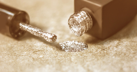 Texture of shiny nail polish shine closeup.a bottle of nail polish next to the brush. The concept of cosmetic advertising.の写真素材