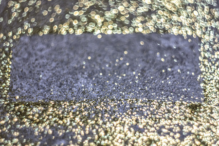 Luxury golden shine background. Golden glitter texture for a Christmas card, banner, cover and a luxury cardの写真素材