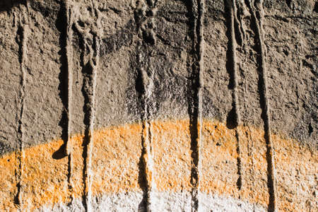 city wall with peeled paint as texture. For backgrounds and texturesの写真素材