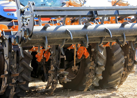 Details of a modern combine harvester close-up. modern combine harvester works in the field. Sowing and harvesting. The concept of agronomy.の写真素材