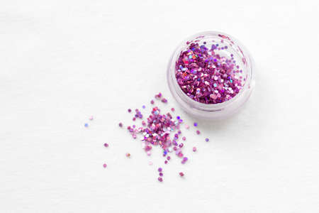 Glitter and sequins for nail design and makeup. decorations for fashion and beauty. Jars with decorの写真素材