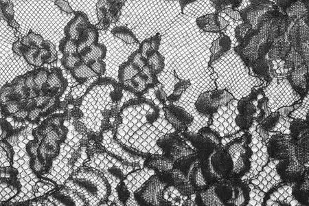 Black lace lace texture background. Black guipure. Black fabric with ornament. Flower lace seamless patternの写真素材