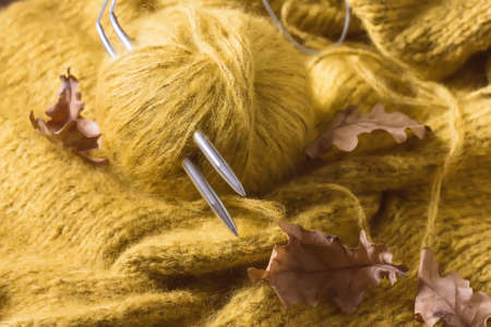 threads and knitting needles. Knitting blankets. Knitted sweater. Needlework as a hobby and business.の写真素材