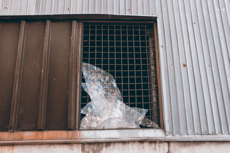 large broken window in an old destroyed building. Old ruined haunted house, abandoned house. The lost city of Pripyat. Chernobyl - image.の写真素材