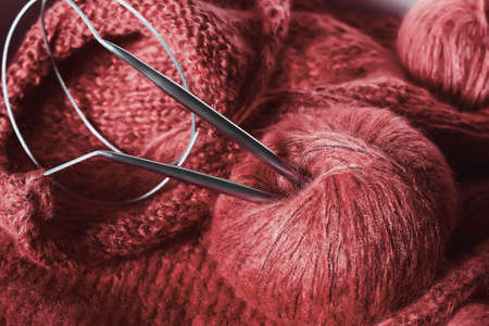 threads and knitting needles. Knitting blankets. Knitted sweater. Needlework as a hobby and business.の写真素材