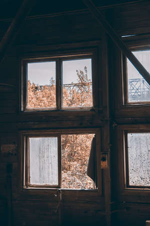 large broken window in an old destroyed building. Old ruined haunted house, abandoned house. The lost city of Pripyat. Chernobyl - image.の写真素材