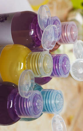 colored bottles for cosmetics, cosmetics and shampoos,の写真素材