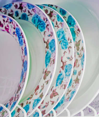 Washed plates stacked vertically, soft focusの写真素材