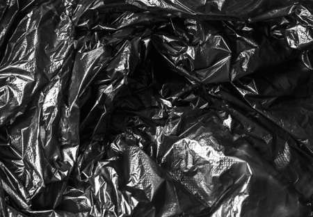 texture of crumpled cellophane black, abstractの写真素材
