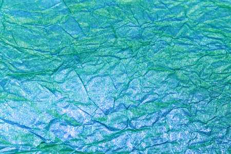 texture of crumpled colored paper with gold plating, crumpled paper for background and texture