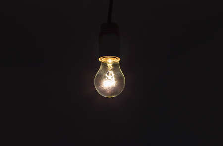 light bulb shines a bright light, soft focus