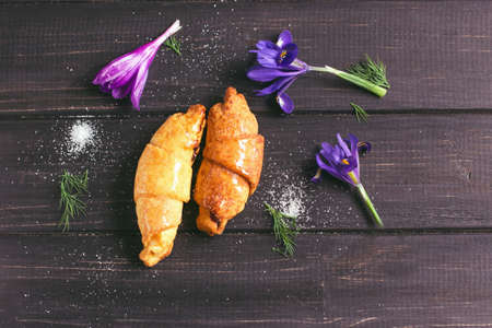 Delicious croissants with jam on a wooden backgroundの写真素材