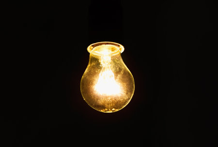 light bulb shines a bright light, soft focus