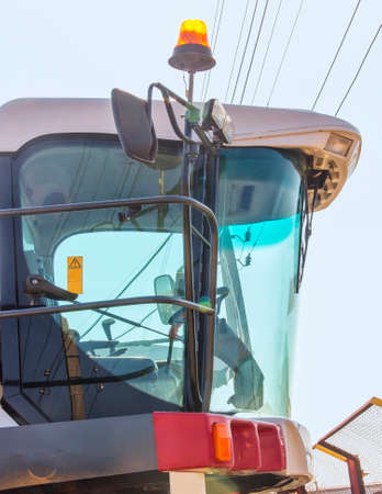 Harvesters and combine parts at the plant are waiting for sales, tractors and agricultural...