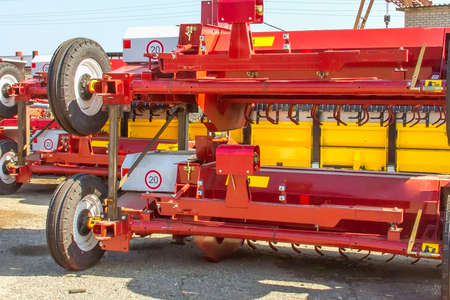 Harvesters and harvester parts at the plant are waiting for assembly, tractors and agricultural machinery, maintenance and exportsの写真素材