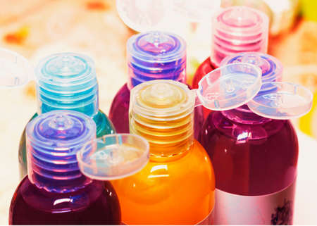 colored bottles for cosmetics, cosmetics and shampoos,