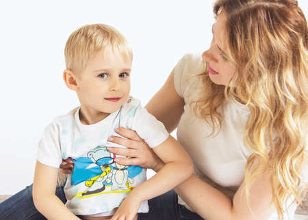 Portrait of a happy mother and her young son. mother and little boy play, selective focus