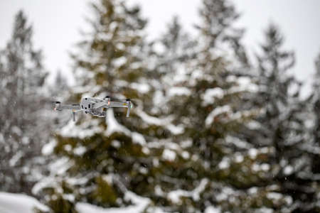 Quadcopter launch in winter snowy forestの写真素材