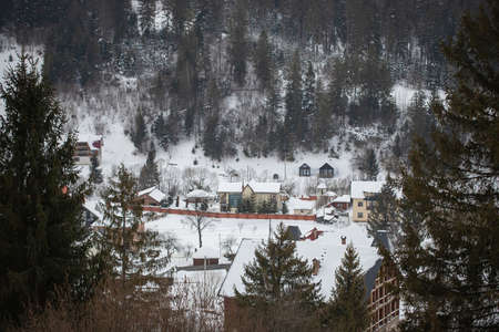 View of a mountain snow-covered village in the Carpathians.