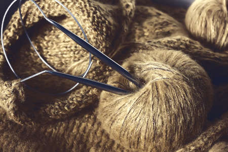 threads and knitting needles. Knitting blankets. Knitted sweater. Needlework as a hobby and business.の写真素材