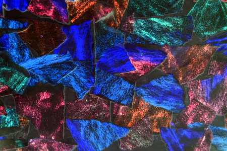 Texture of many pieces of torn paper. Shreds of torn colored paper. Puzzle. abstract background