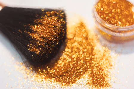 texture of gold glitter on the makeup brush and design. On white background. Selective Focus - Pictureの写真素材