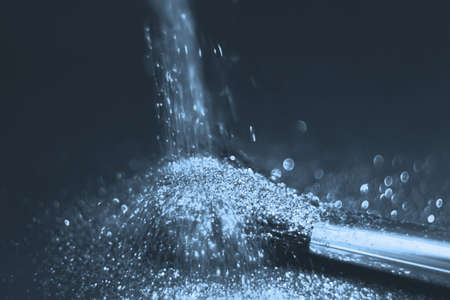 texture of gold glitter on the makeup brush and design. We have a black background. Selective Focus - Pictureの写真素材