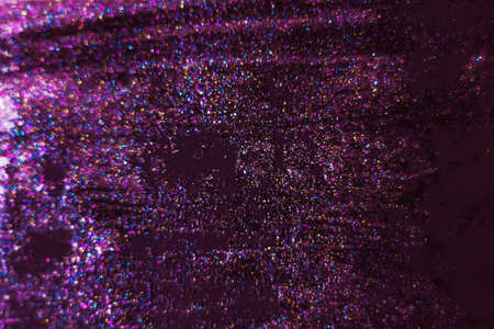 Gold and pink glitter on a black background as a background. Abstract christmas background with festive lights and copy space - magic bokeh sparkle. unfocused, focused - Imageの写真素材